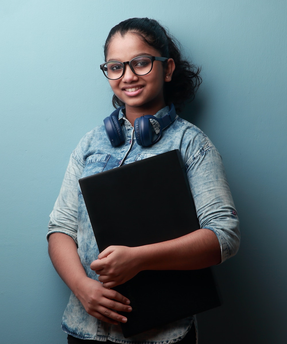 Girl holding a laptop